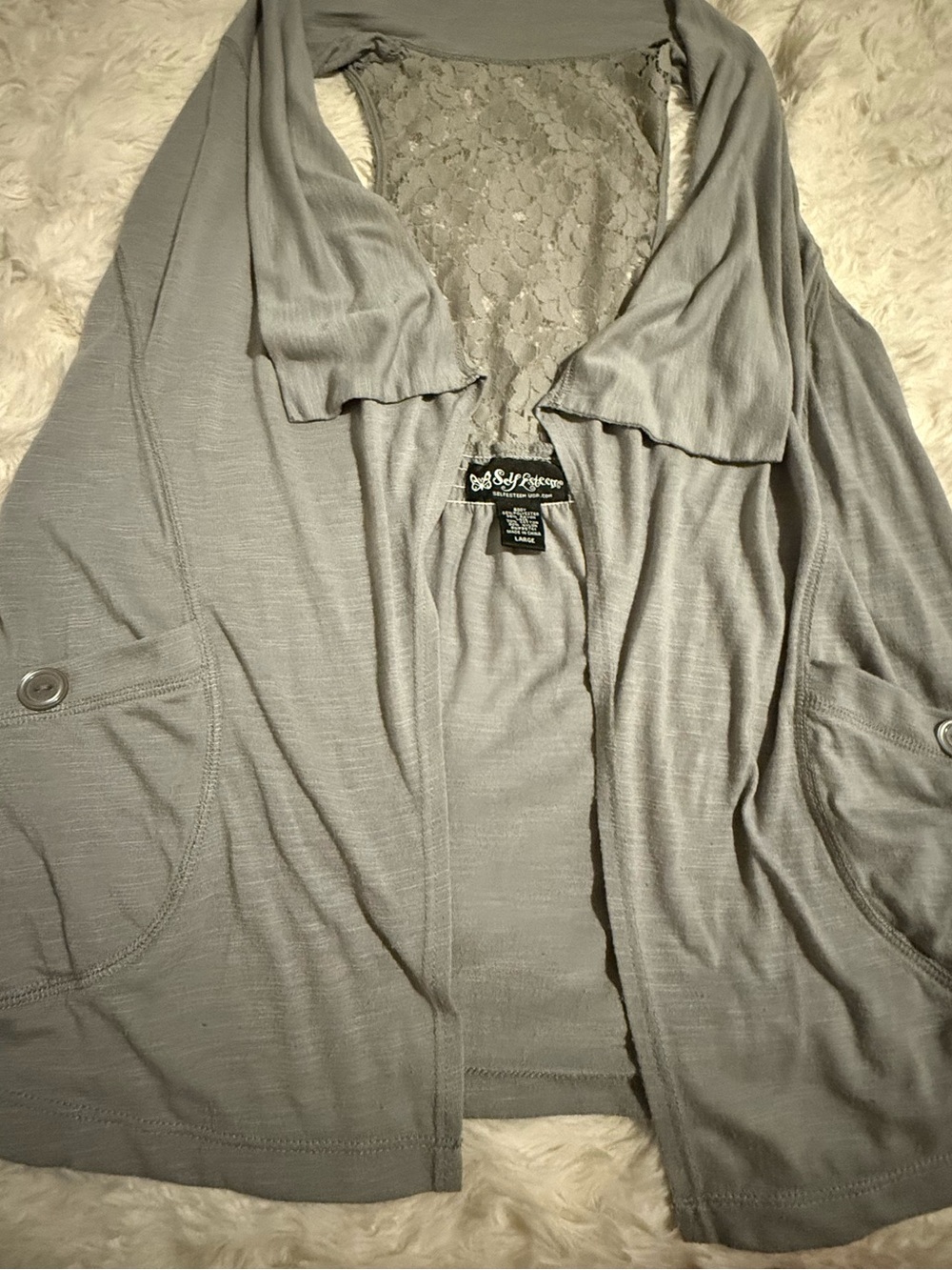 Self Esteem open-front cardigan w/ a draped collar, front pockets, lace back
